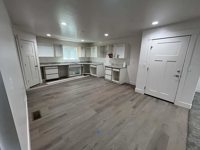 Kitchen, front door (right), pantry door (left)