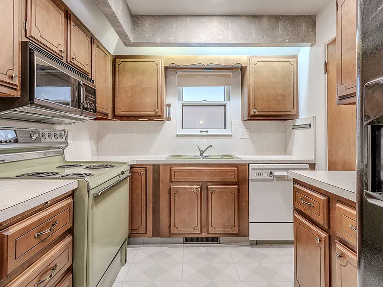Full kitchen with dishwasher, stove, microwave, large pantry. Retro charm, lots of cabinets includes lazy Susan.