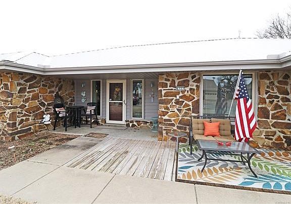 Front Porch Entry:  Lodge appeal with New gray metal roof & gorgeous remodel inside;  New Roof, Vinyl Windows, & HVAC, water heater also.  Enjoy this home inside and out!