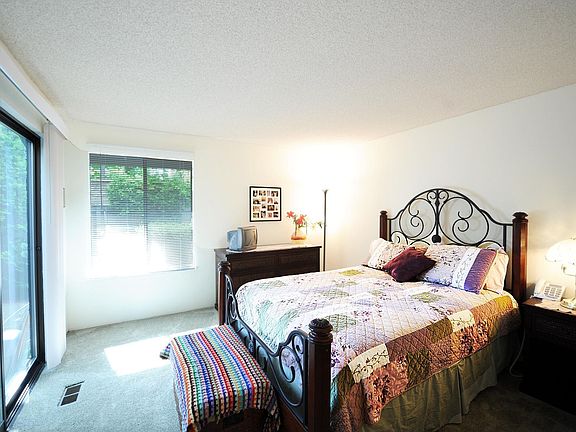 Master bedroom w/ slider to the fully fenced back yard