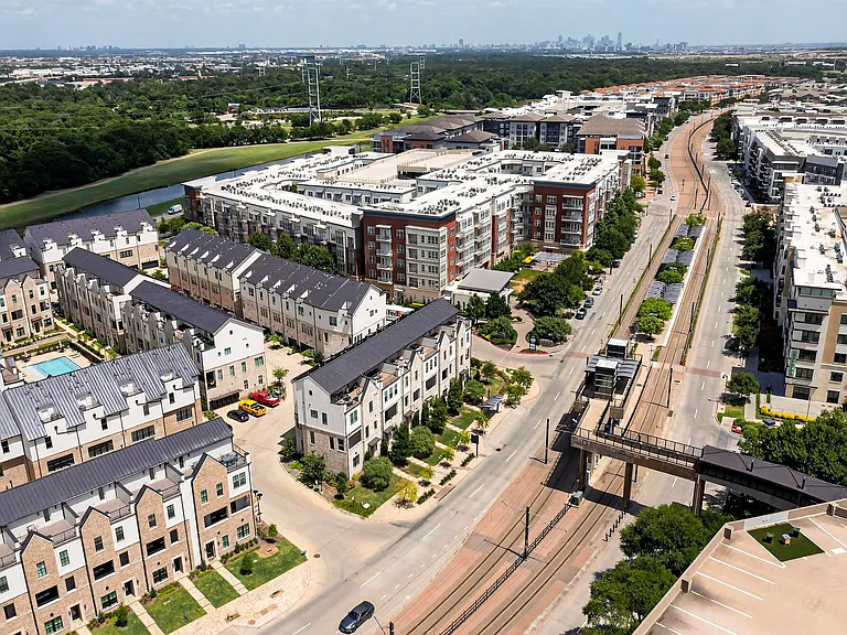 Community view featuring Downtown Dallas at the top, Dart Rail Orange line to Downtown or DFW Airport in the middle, Campion Trail on the left, and Lake Carolyn on the right of the picture.