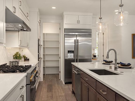 Plenty of cabinet space plus a walk-in pantry