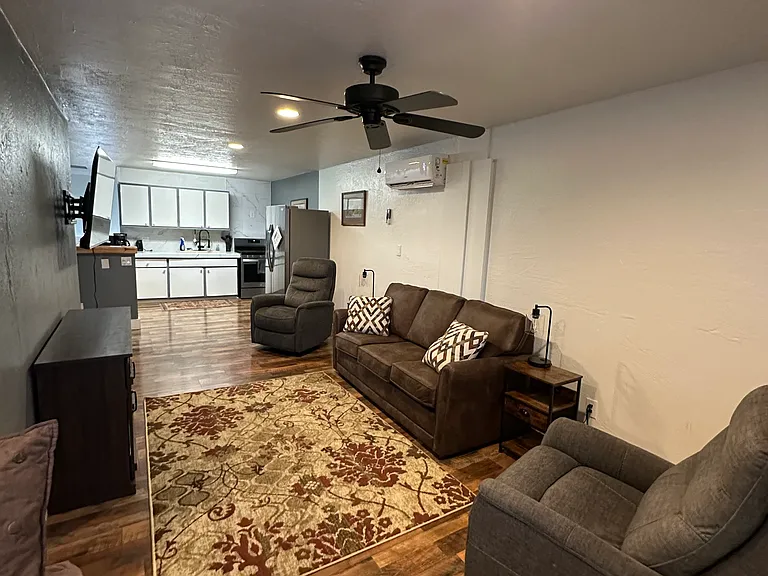 Living Room with Queen Sofa Sleeper and 2 Rocker Recliners.