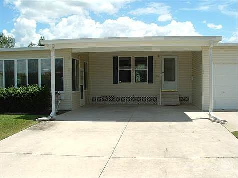 FRONT VIEW, WIDE DRIVEWAY