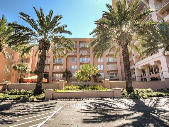 Gorgeous palm trees lead you to the entry with valet parking.