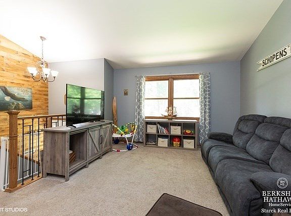 Large living room with vaulted ceiling.