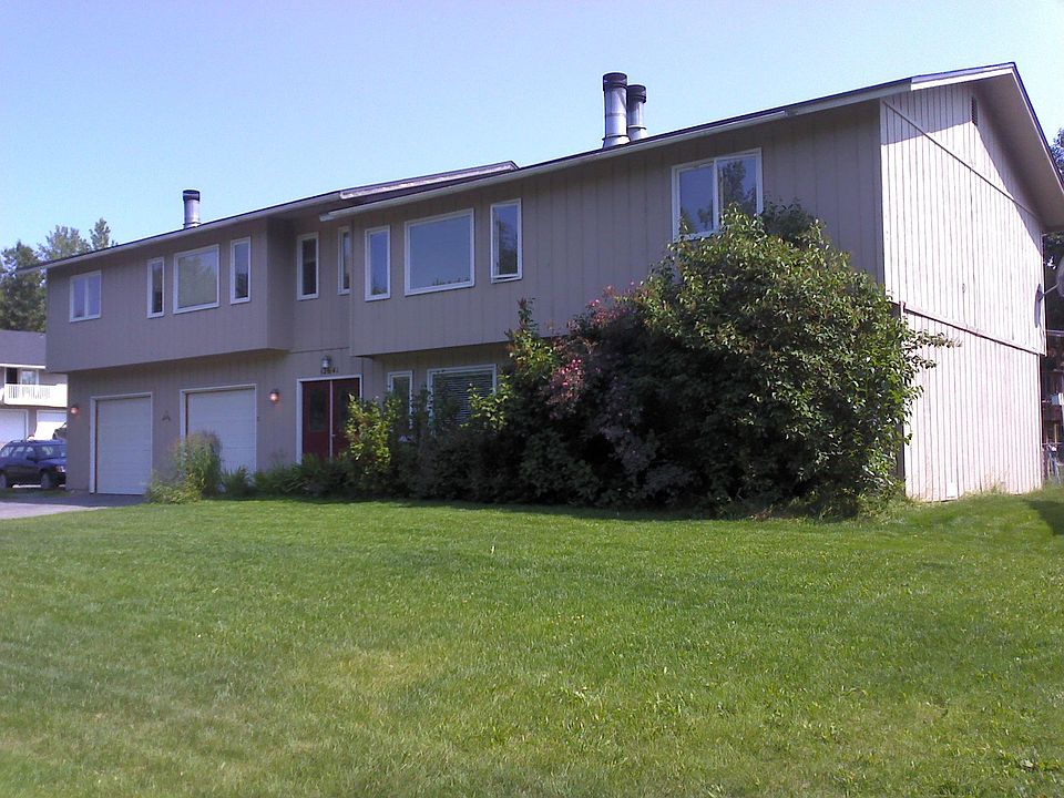 Triplex with large lawn.