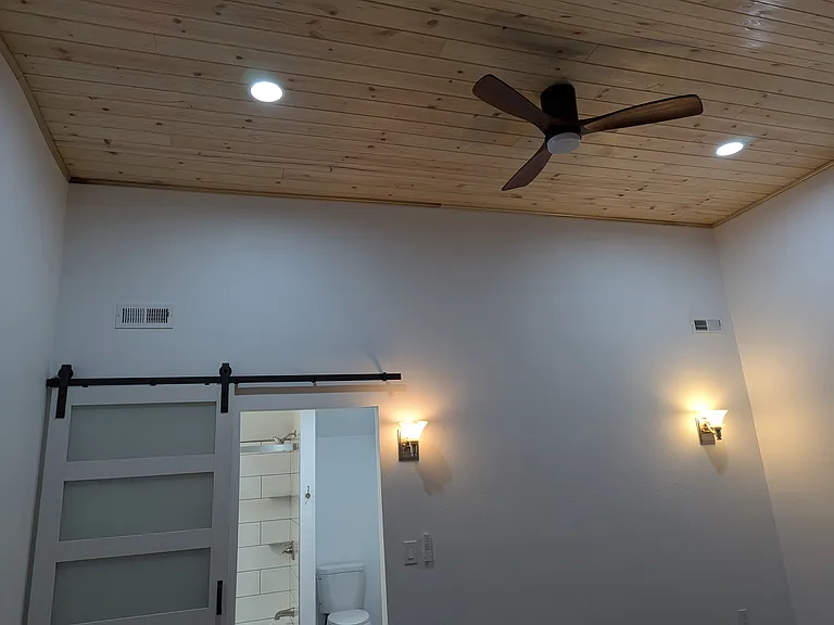 Nice light pine ceilings and recessed lighting makes the room nice and bring, well placed electrical outlets to design your master suite however you want.