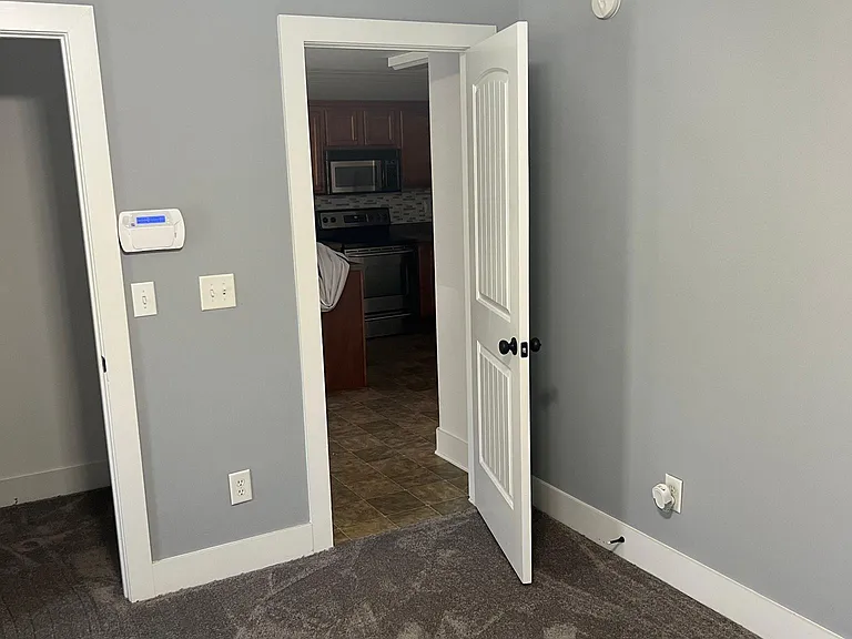 Master bedroom entrance off kitchen