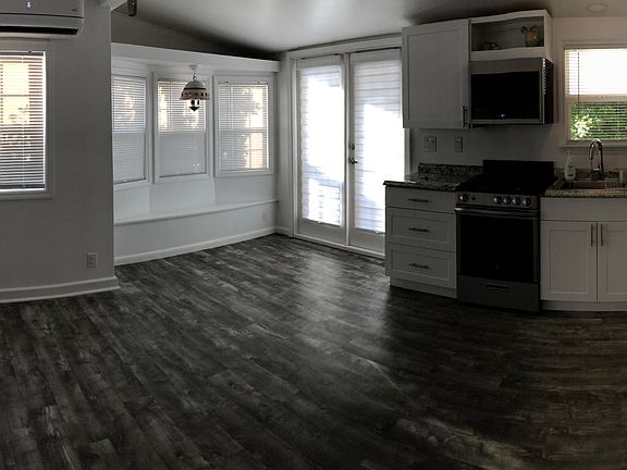 A view of the living/dining/kitchen area (I'm not the best photographer) All windows throughout the unit have new cordless blinds.