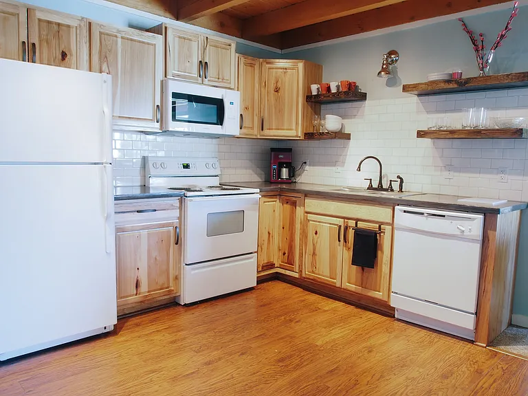 Full kitchen with appliances and utensils