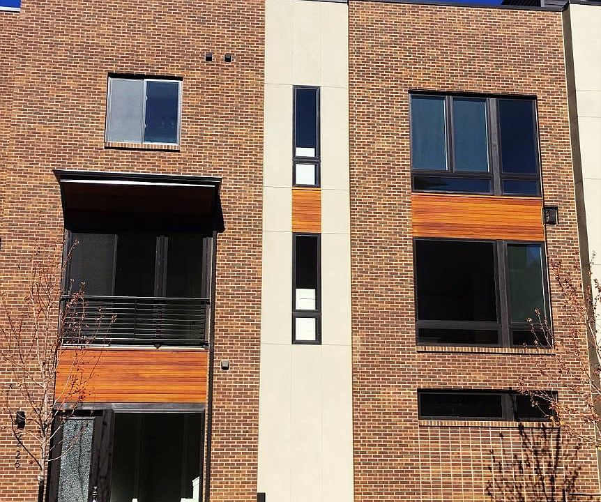 Front entry on the south facing facade, overlooking the green grass of your courtyard.