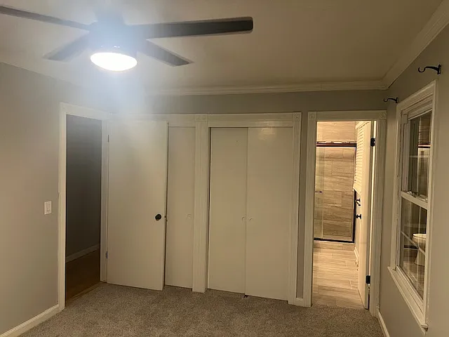 Primary Bedroom with Double Closet with Brand New Carpet.