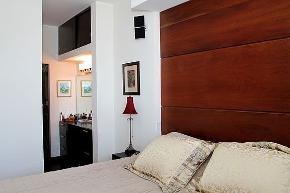 Bedroom has built in platform and nightstands