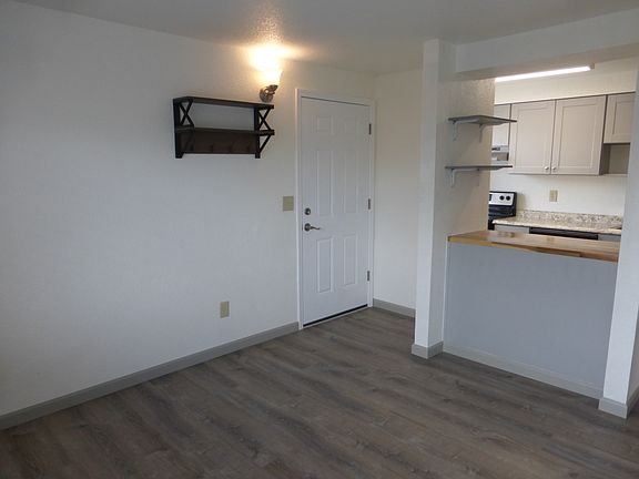 Coat hanger and wall shelves for more storage and convenience.