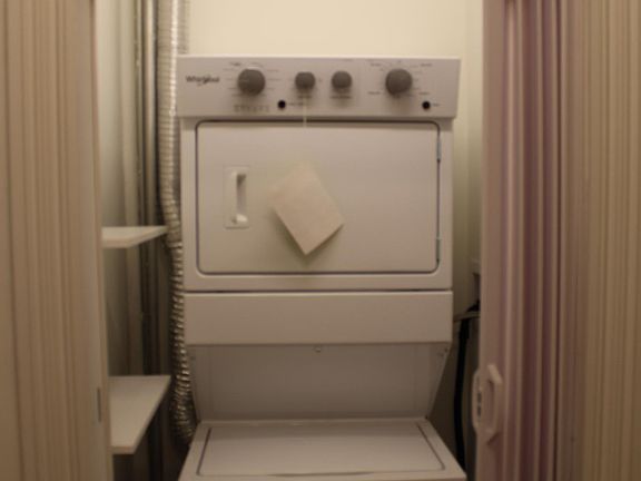 Laundry closet in hallway (next to bathroom)