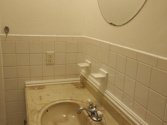 Bathroom has full sized bathtub