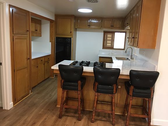 View of kitchen with pass-thru window to dining room