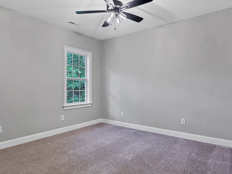 bedroom 3 with closet and window