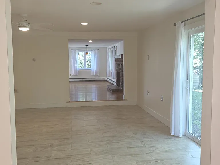New Office Or Library Space Leading Into Living Room and Dining Room Area, All Located on 1st Floor Of Unit