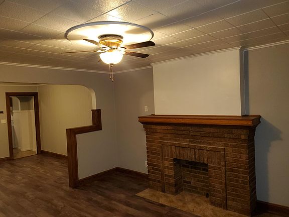 Living room, faux fireplace.