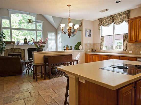 Travertine floors throughout kitchen and family room