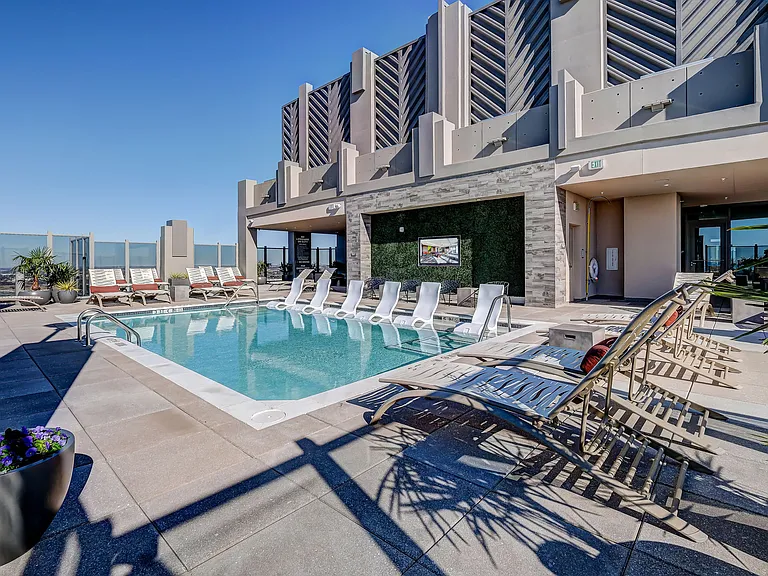 Stunning roof top pool on the sky deck with tanning deck and stunning city views