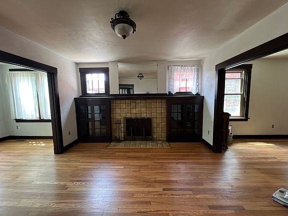 Living room, between dining area and sunroom. non-functioning fire place
