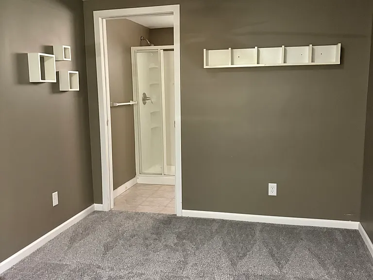 Master bedroom with walkout to patio.