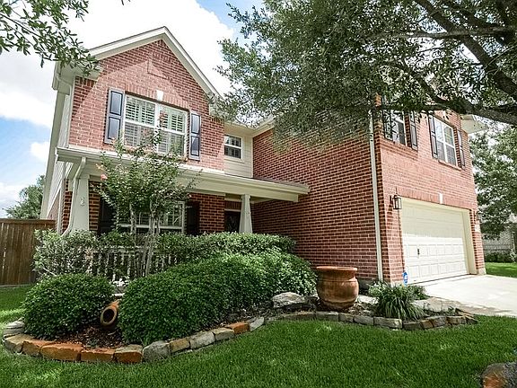 Immaculate landscaping gives this charming home a welcoming feel from the moment you arrive.