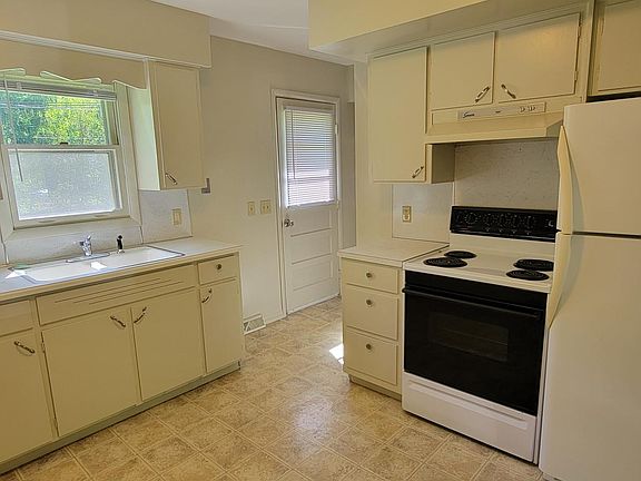 Kitchen with door to back yards.