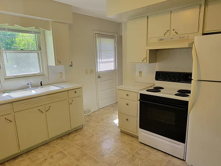 Kitchen with door to back yards.