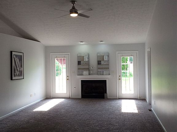 Living room with cathedral ceiling and gas fireplace