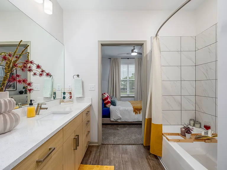 Modern apartment bathroom with clean, functional finishes.