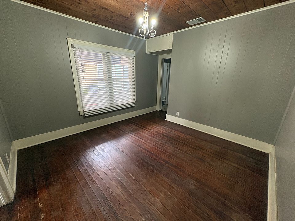 Past the living room is a separated room that can serve as a dining room or office.