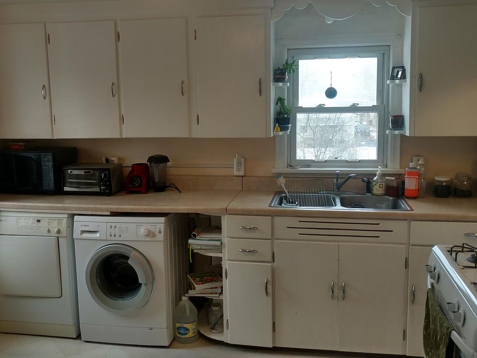 Kitchen with under counter laundry.