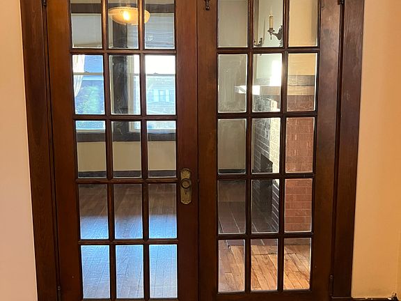 Dining room looking into living room with lovely glass doors