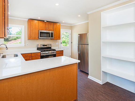 Brand new kitchen with stainless appliances, new flooring an