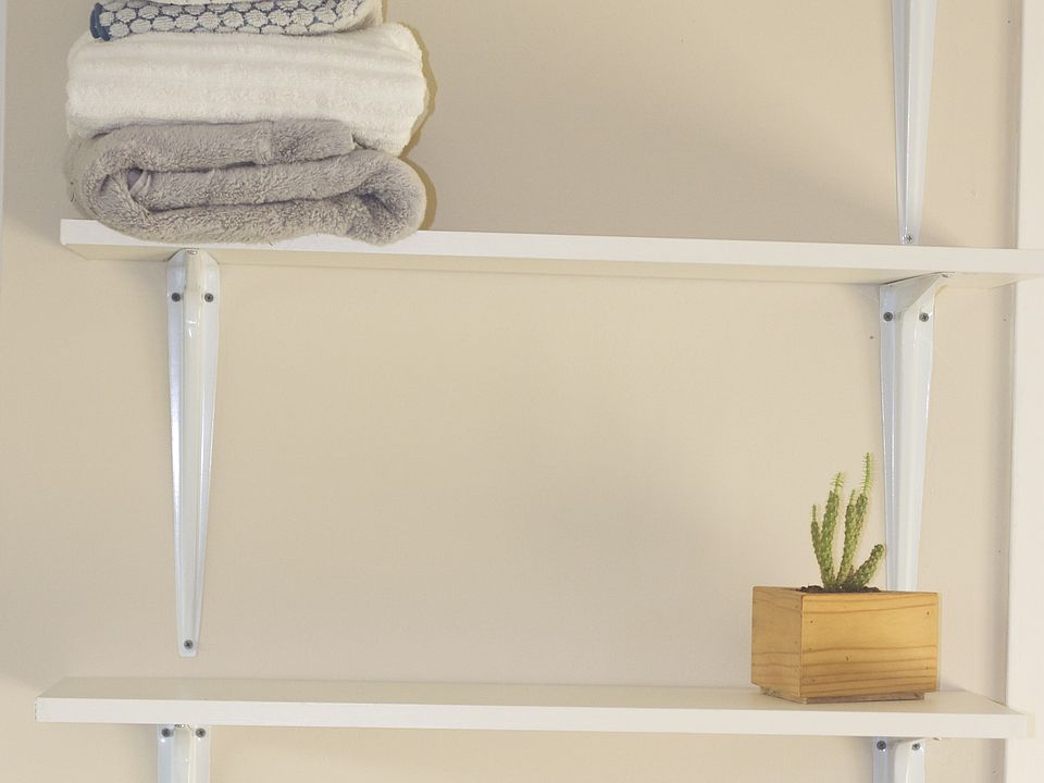Additional shelving available between the kitchen and bathroom