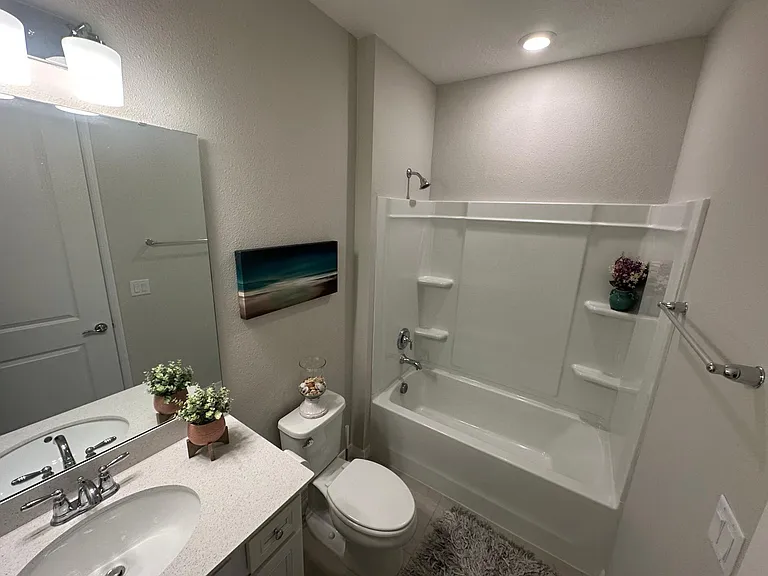 Bathroom, 2 quartz counters, LVP floor tub, shower combo