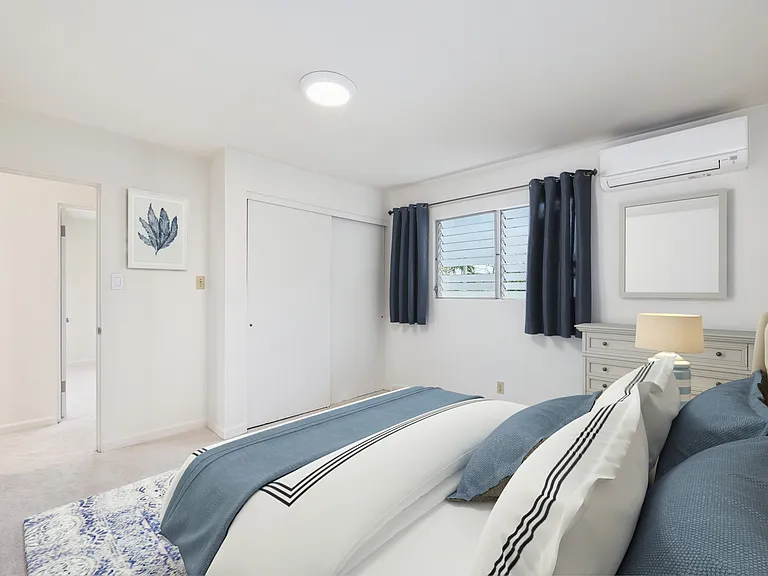 Primary bedroom has 2 double door closets (the one on the left not seen in photo.) Split AC in this and all bedrooms, and most rooms.