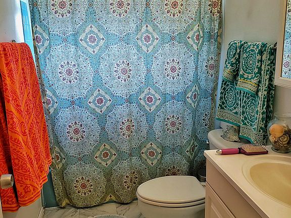 Full bath with great natural light from the window.