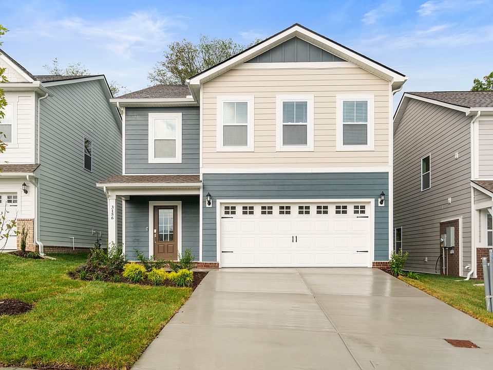 Beautiful 2 story home with serene pastel colors. Front view-2 car garage