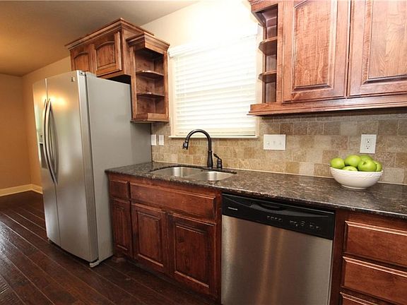 Custom Cabinetry with Granite Countertops.  Fridge Conveys!!!