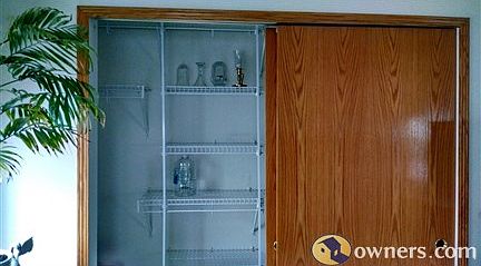 Dual closets in Master *hers" has shelving