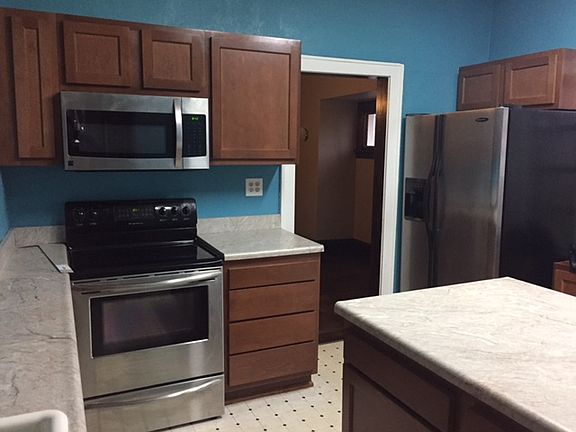 Spacious remodeled kitchen with new cabinets & counter-tops.