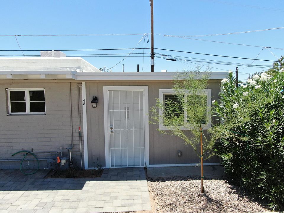 Front view of front door. Door looks out toward Palm Lane and parking lot.