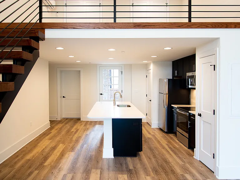 Experience the sophistication of this chic loft kitchen, perfectly blending style and functionality.