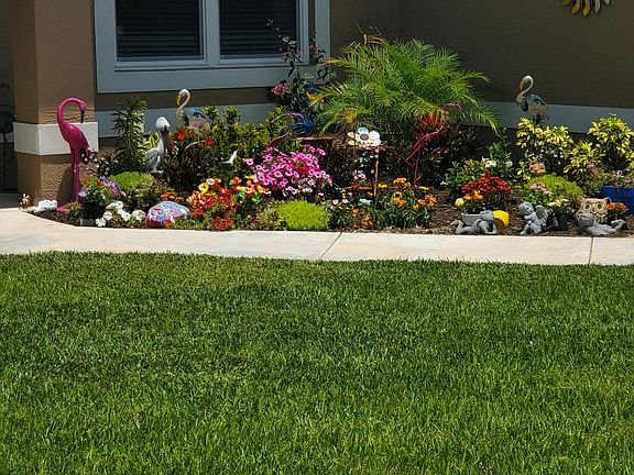 right side of front of my home - I love planting flowers.