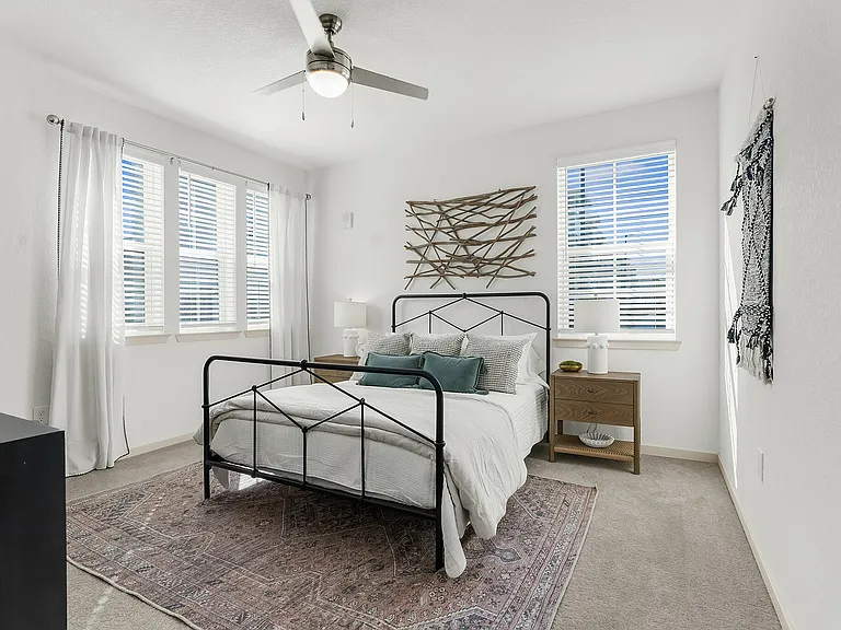 Embrace tranquility in this elegantly designed bedroom filled with natural light.